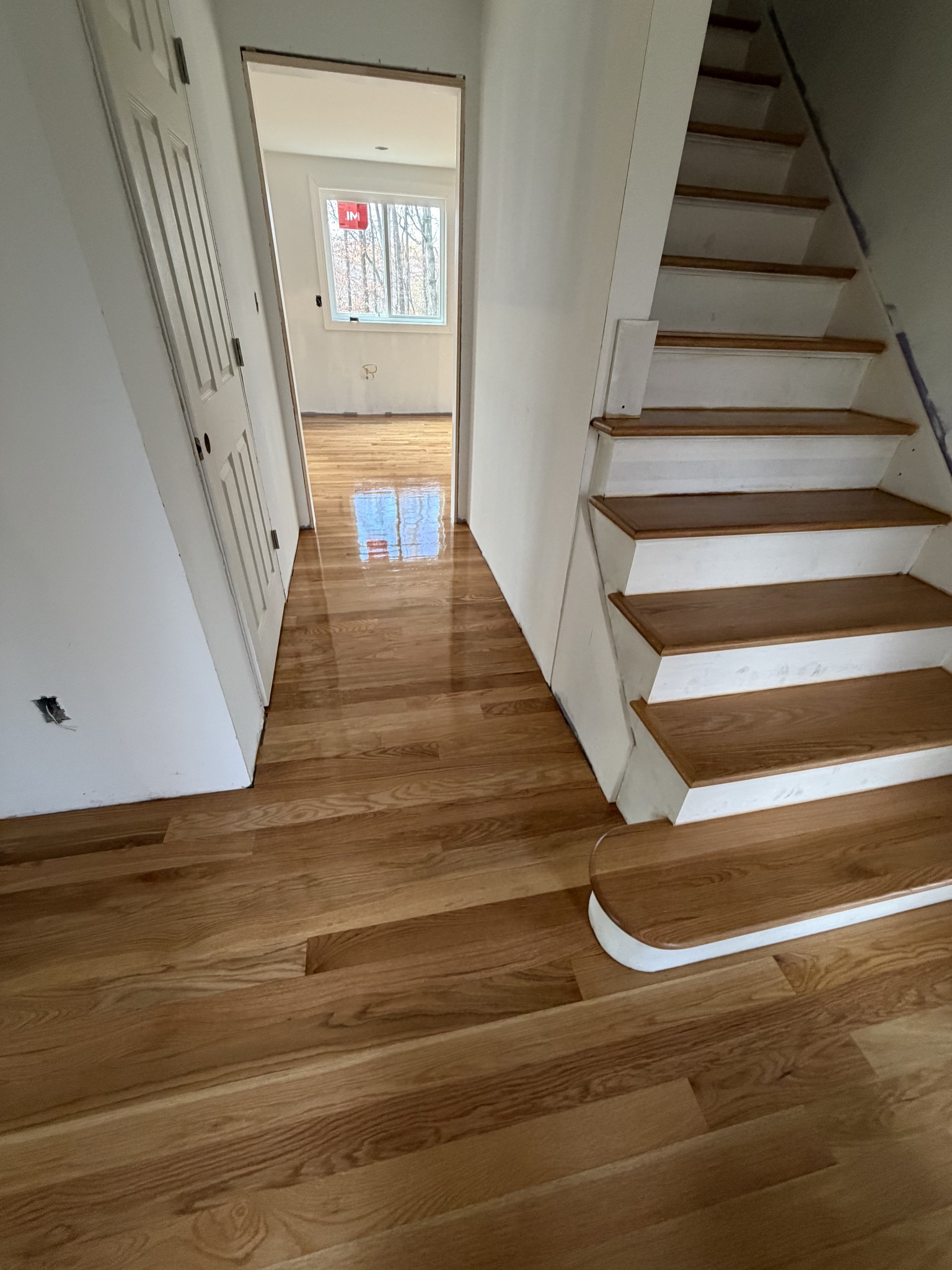 Hardwood flooring contractor CT — spacious room after install