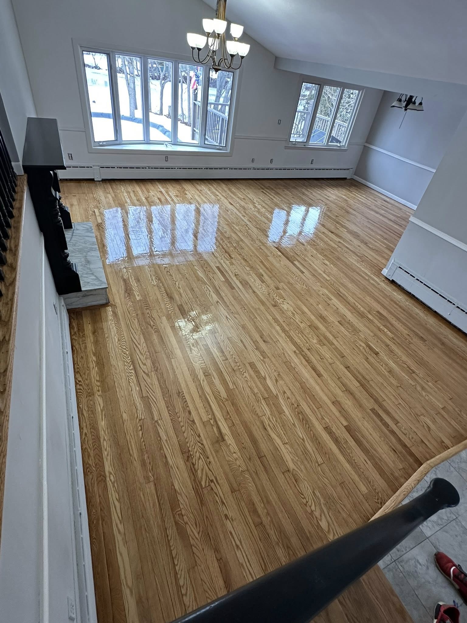 Polished hardwood floors reflecting natural light — CT project